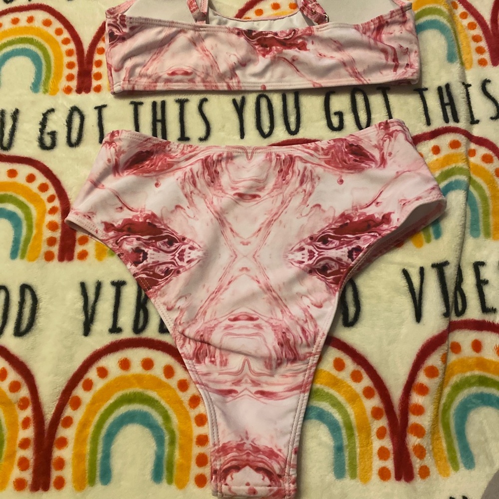 Great condition no rips never worn Fits more of a medium Polyester and spandex.